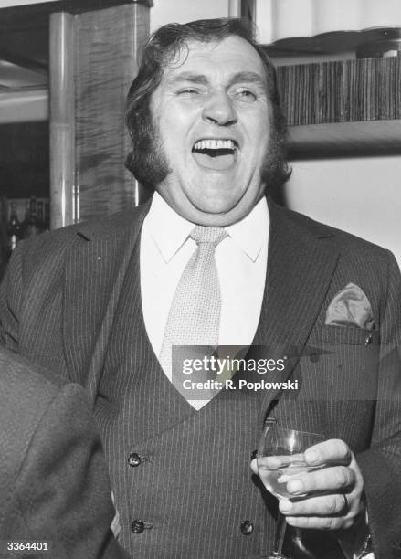 British comedian Les Dawson laughing out loud.