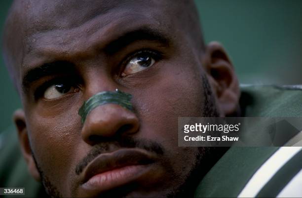 Portrait of Ernie Logan of the New York Jets as he sits on the sidelines during a game against the Atlanta Falcons at Giant Stadium in East...