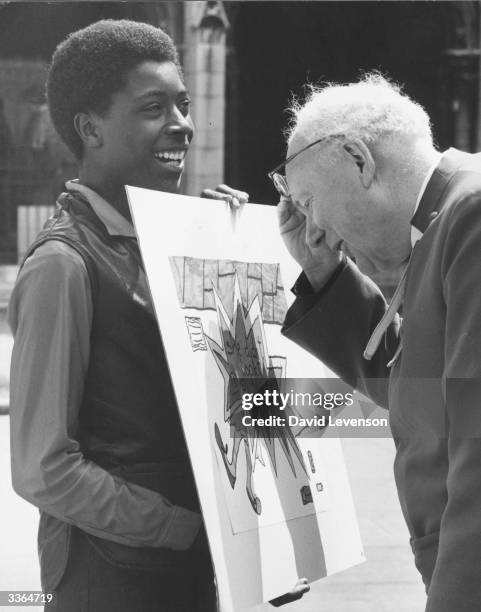 Edward Carpenter, the Dean of Westminster, looks at a painting by prize-winner Herbert Walters. 120 pictures have been picked for the 'Painting A...