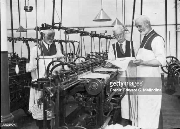 Three workers at the I & R Morley cloth-weaving factory in Heanor, Derbyshire.