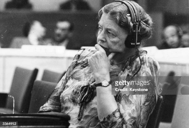 Eleanor Roosevelt, humanitarian, the widow of American President Franklin Delano Roosevelt and representative to the United Nations, listening...