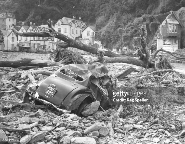 Lying crushed among the trees and rubble, is one of the many cars swept away by the flooding at Lynmouth.