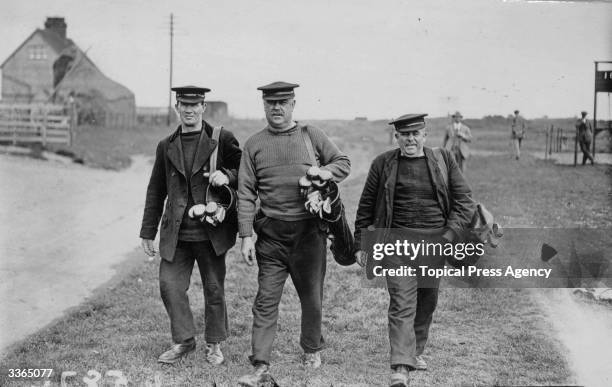 Caddies at the Amateur Golf Championships in Deal.