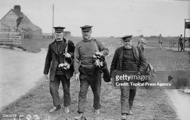 Caddies at the Amateur Golf Championships in Deal.