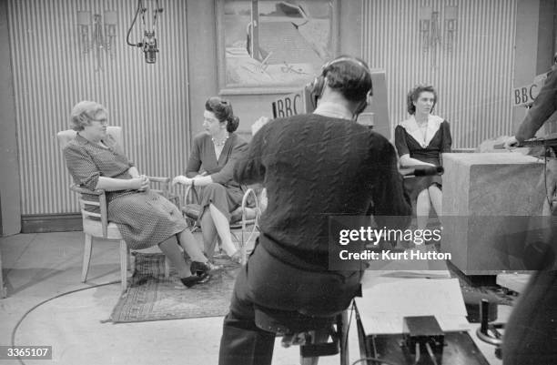 At the first BBC television show designed specially for women journalist Jeanne Heal interviews Miss Myra Curtis, chairman of the Curtis Committee...