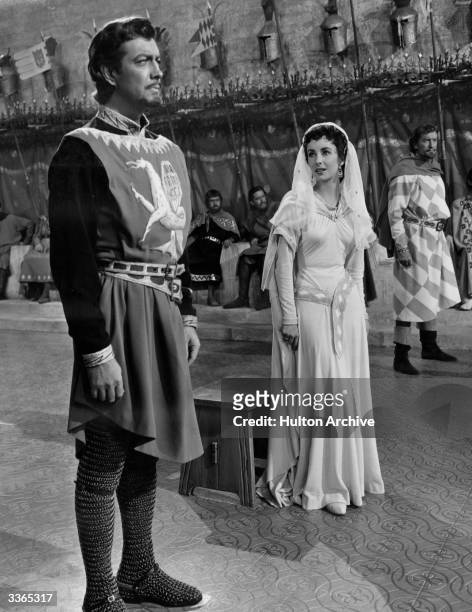 Robert Taylor playing the eponymous Ivanhoe in a scene from the 1952 film with leading lady Elizabeth Taylor and villain George Sanders.