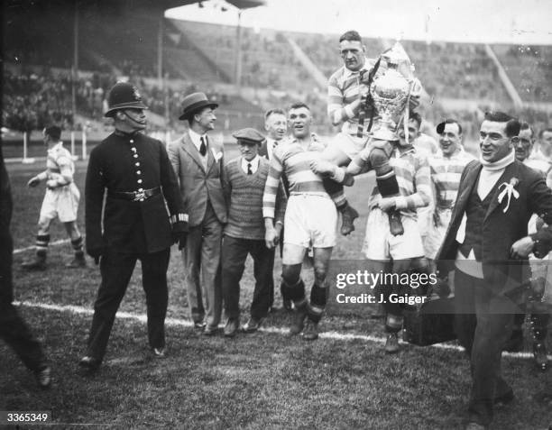 The Halifax Rugby League team celebrating their win over York in the Challenge Cup Final at Wembley Stadium, London.