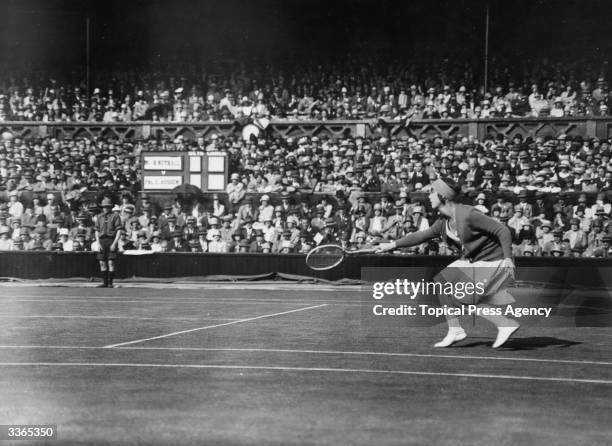 German tennis player Cilly Aussem in action against Britain's Betty Nuthall during their match at the Wimbledon Lawn Tennis Championships.