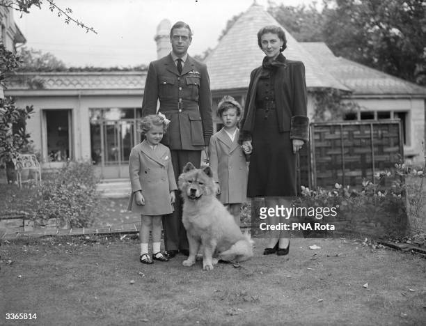 The Duke and Duchess of Kent pose in the garden of the Buckinghamshire home, with Prince Edward, Princess Alexandra and their dog Muff.