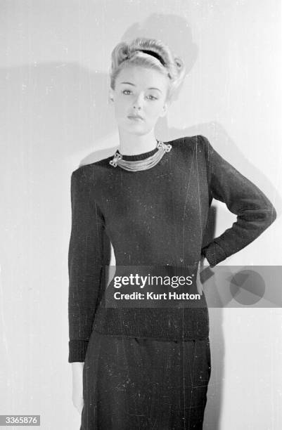 The English actress Susan Shaw models a hand-knitted black woollen jumper and long black skirt Original Publication: Picture Post - 4482 -...