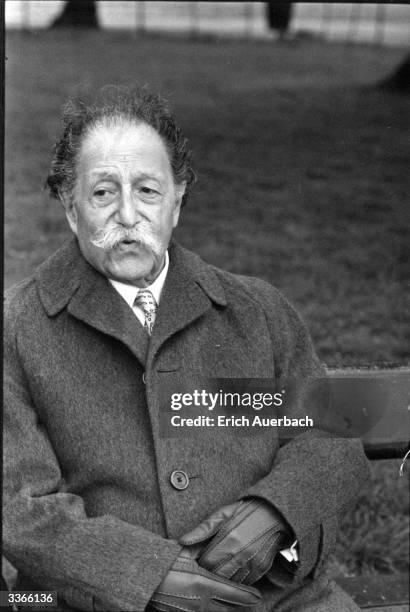 French-born US conductor Pierre Monteux sitting in Hyde Park, London.