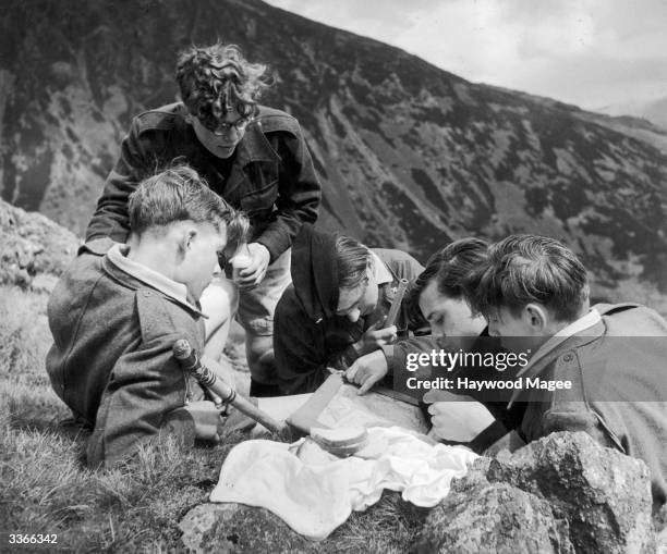 Students of the Aberdovey Outward Bound School study their maps whilst on a walk on Cader Idris. Original Publication: Picture Post - 4815 - A Sea...