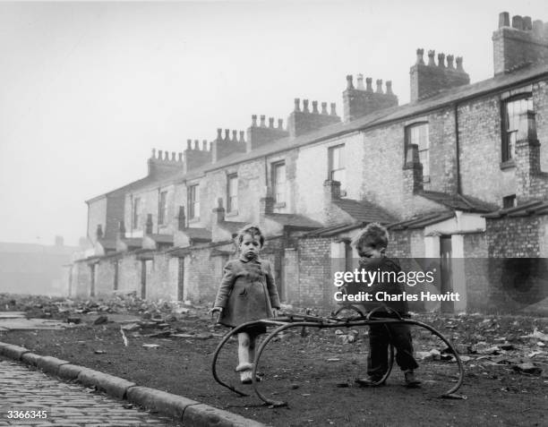 Children in the slum district of Hulme in Manchester. Original Publication: Picture Post - 6871 - Best And Worst Of British Cities - Manchester -...