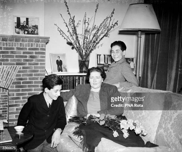 Queen Marie, mother of King Peter of Yugoslavia, at her English country home with her two younger sons, Prince Andrej and Prince Tomislav.