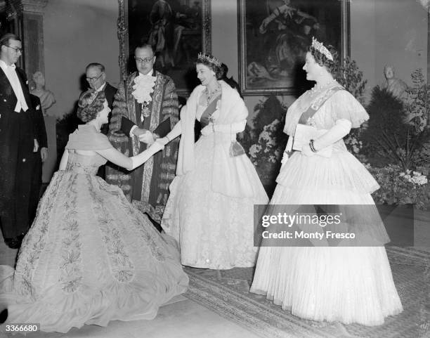 Queen Elizabeth The Queen Mother , greeting Mrs Geralde Legge with Queen Elizabeth II at a party hosted by the Mayor of Westminster at the Royal...