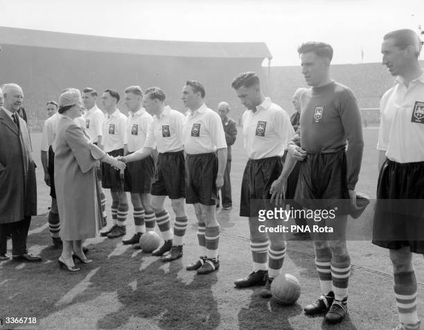 Queen Elizabeth The Queen Mother meeting Preston North End football team before their FA Cup Final match against West Bromwich Albion FC at Wembley...