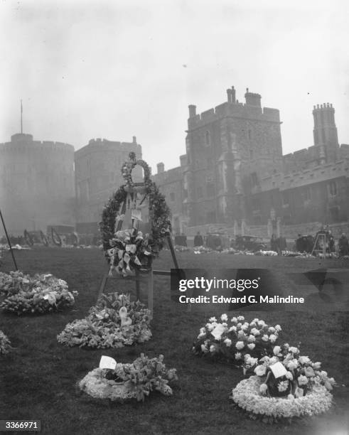 Floral tributes to the late King George VI lie near St George's Chapel at Windsor Castle.