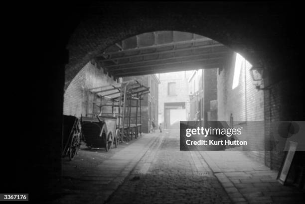 Storey Street in a poor area of Salford. Original Publication: Picture Post - 41 - Manchester - pub. 1938