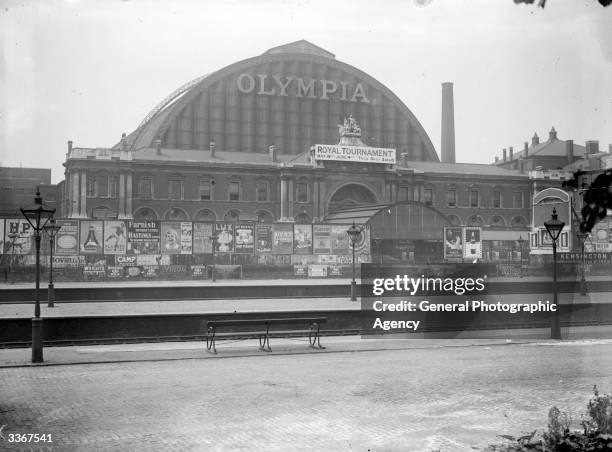 Signs advertising the Royal Tournament show outside Olympia Exhibition Hall at Olympia, London.