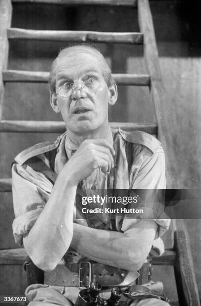 English comic actor Will Hay plays Professor Benjamin Tibbetts in the film 'Old Bones of the River', directed by Marcel Varnel and produced by...