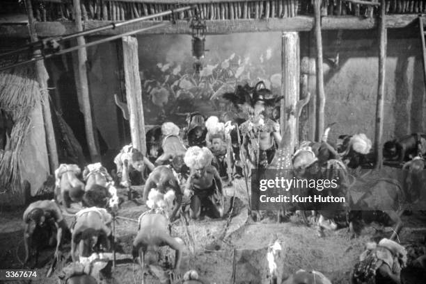 Extras on the set of the film 'Old Bones of the River', directed by Marcel Varnel and produced by Gainsborough Pictures. Original Publication:...