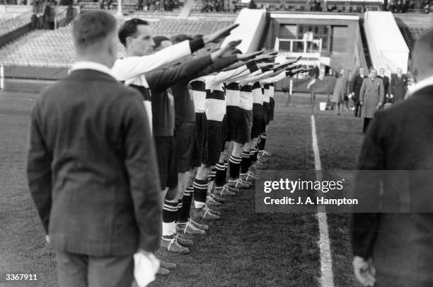 The players of the German Universities team give the Nazi salute during their national anthem before playing a match against Britain at Wembley...