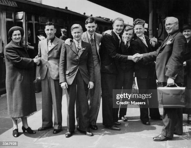 Friends and relatives see off a party of boys from Cardiff station, as they travel to New South Wales, Australia, under the Overseas Settlement...