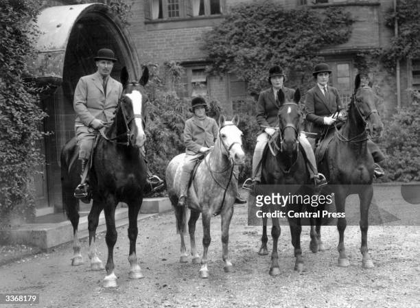 Lord and Lady Digby and their two daughters Pamela and Jaquetta on horseback at their home in Dorset.