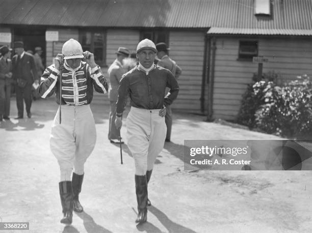 Jockeys G Armstrong, who rode Farrago, and Lord Carnarvon, who rode Knight of Lorn to victory in the Lingfield Club Welter Stakes, going to the...