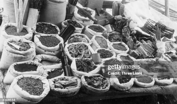 Medicinal herb stand in Armenia selling herbs and treatments including rose petals, dried starfish, quinine bark and chalk in plaque form with...
