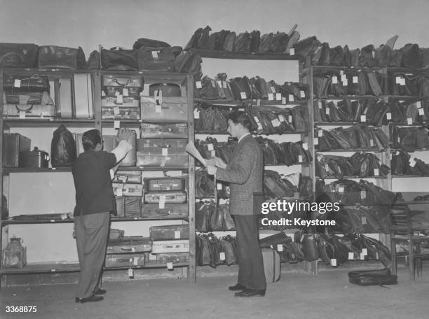 Unclaimed articles of baggage cram the shelves of a Lost Property Office in Rome.