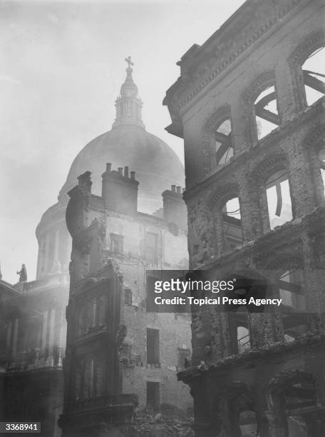 Buildings devastated during air raids near the dome of St Paul's Cathedral in the City.
