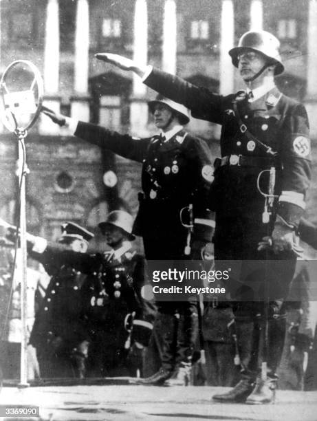 Nazi official Heinrich Himmler taking the salute at a parade, he was later appointed head of all German Police Forces including the infamous Gestapo.