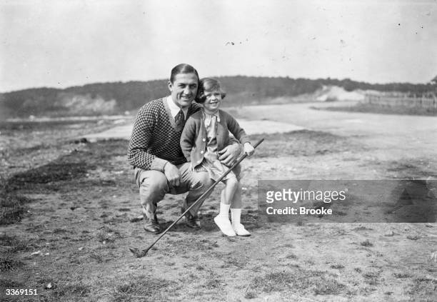 French boxer Georges Carpentier with his daughter Jacqueline at Le Touquet for a game of golf.