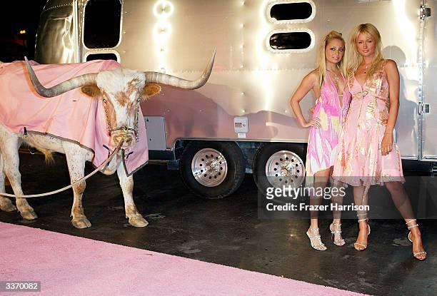 Nicole Richie and Paris Hilton aririve for the "Simple Life 2" Welcome Home Party at The Spider Club on April 14, 2004 in Hollywood.