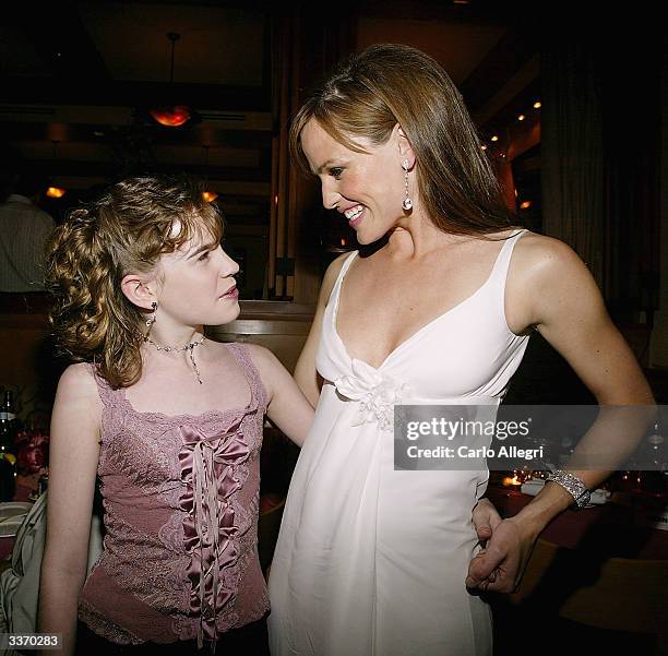 Actress Christa Allen and actress Jennifer Garner hug at the after party for the film "13 going on 30" following the premiere of the film April 14,...