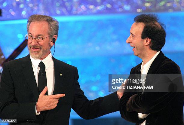 Film director Steven Spielberg jokes with Italian actor and director Roberto Benigni before receiving his David prize, the Oscar of the Italian...