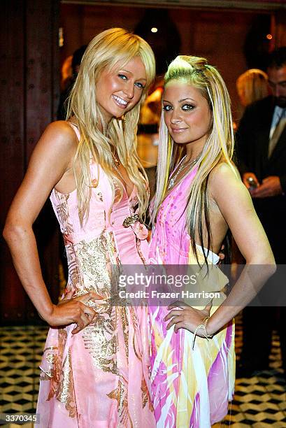 Nicole Richie and Paris Hilton aririve for the "Simple Life 2" Welcome Home Party at The Spider Club on April 14, 2004 in HHollywood, California.