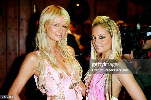 Nicole Richie and Paris Hilton aririve for the "Simple Life 2" Welcome Home Party at The Spider Club on April 14, 2004 in Hollywood, California.