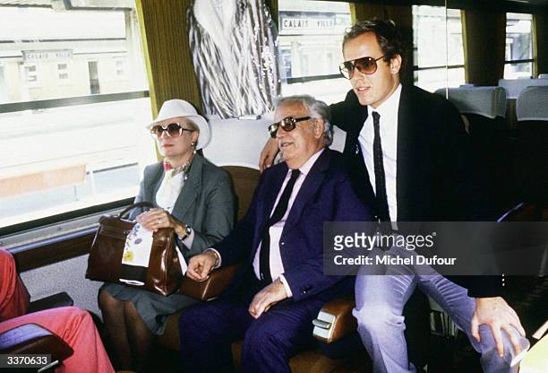 Prince Rainier III of Monaco with Princess Grace Kelly and son Prince Albert at the North Station before going to a cruise to the North Pole in Monte...
