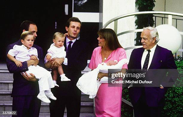 Prince Rainier III of Monaco poses for the birth of Princess Caroline's baby Pierre Casiraghi as Prince Albert stands with her other son Andrea and...