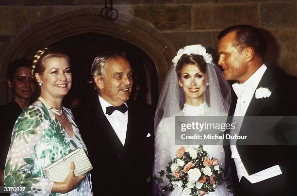Prince Rainier III of Monaco with wife Princess Grace Kelly posing at the wedding of her brother Jack Kelly in 1981 in Philadelphia, Pennsylvania.