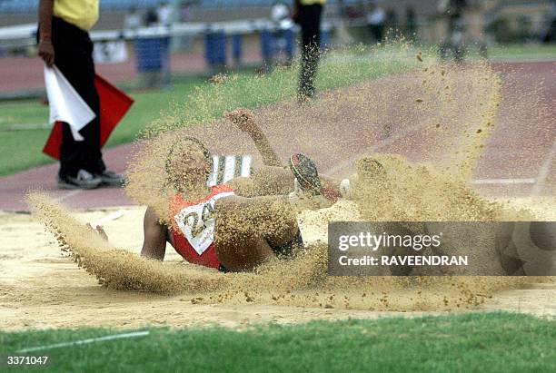 Indian long jumper Anju B. George lands in the pit during one of her attempts in the National circuit meet in New Delhi ,15 April 2004. Anju, the...