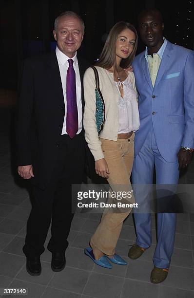 Mayor, Ken Livingstone with designer, Oswald Boetang and his wife at the UK premiere of 'Minority Report' starring Tom Cruise held at the Odeon,...