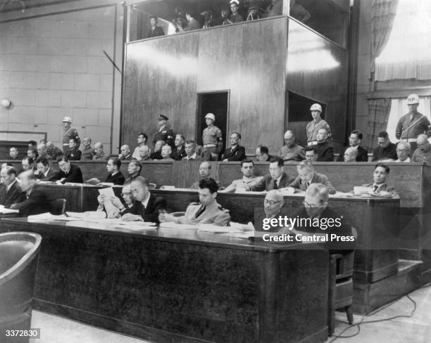 The defendant's bench as 28 Japanese military leaders are arraigned on war crimes charges before the International Crimes Tribunal in Tokyo. Former...