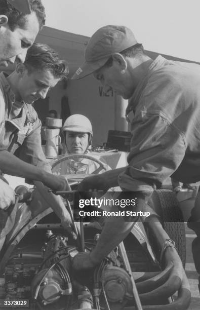 Engineers change spark plugs on the Ferrari of Dr Giuseppe Farina , a lawyer and successful motor racer, he became the first ever world champion at...