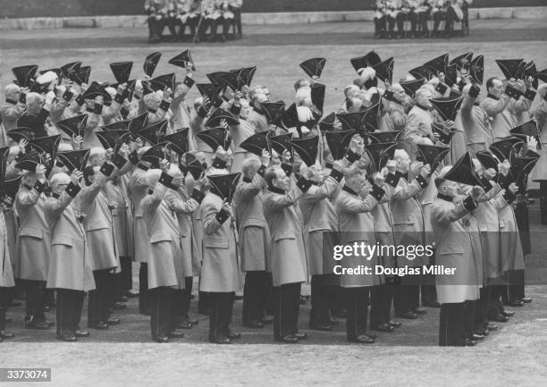 The Chelsea Pensioners giving three cheers to the Queen during Founders day at the Royal Hospital in Chelsea.