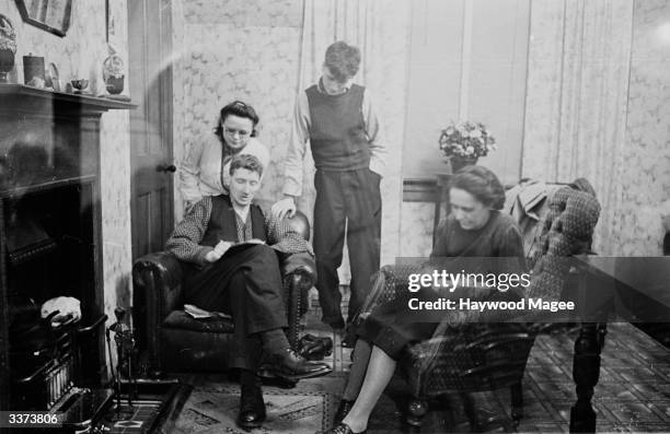 The Innes family in their home at Gilmerton in the Midlothian constituency, where a by-election has pitted a supporter of the war-time coalition...