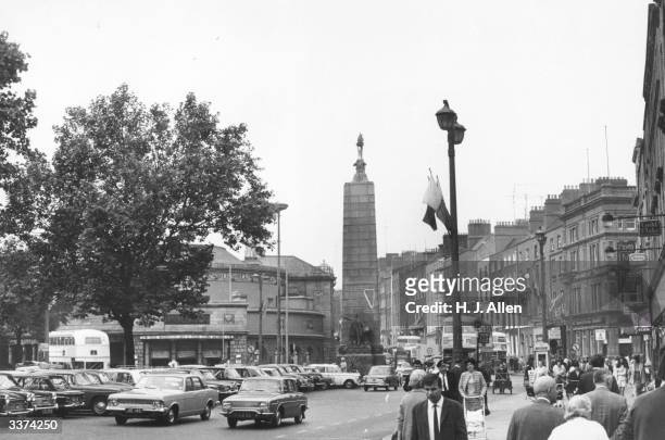 Connell Street in Dublin with the statue of Irish nationalist and statesman Charles Parnell in the background. The statue was erected by the Irish...