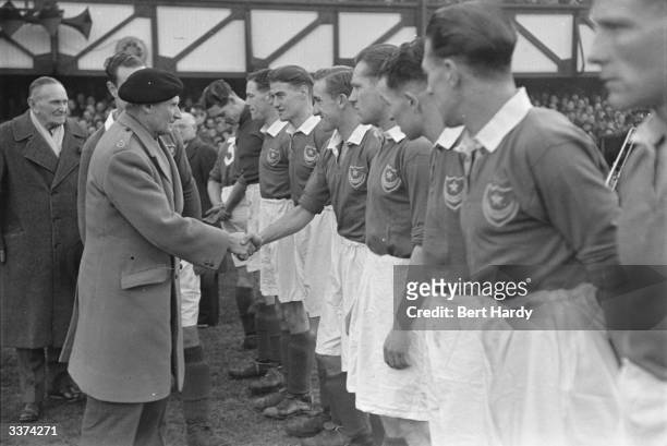 Portsmouth FC was formed in 1898 and celebrating its Golden Jubilee. Field Marshal Montgomery who is President of the club greets the players before...